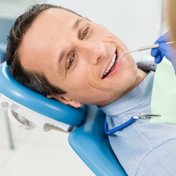 Man in dental chair for consultation.