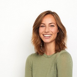 Woman in olive shirt smiling