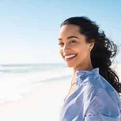 Lady smiles on beach